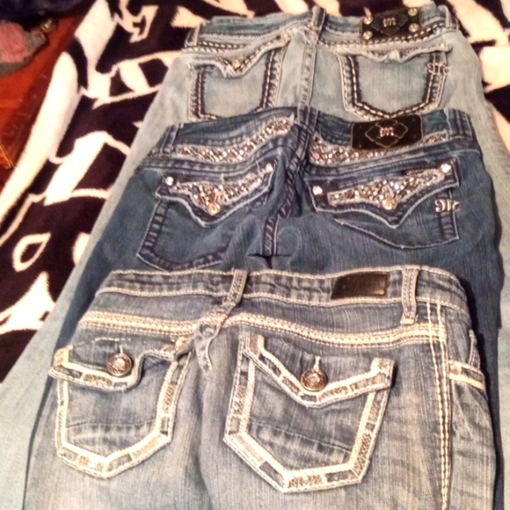 Three pairs Miss me jeans size 27 and 28 the one pair of jeans is a small